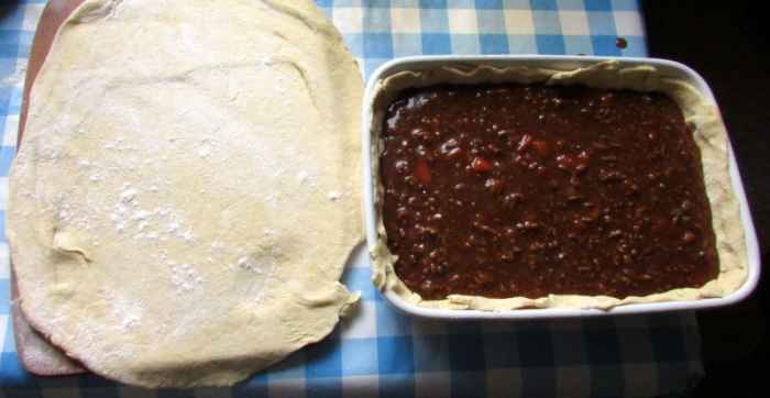 Roll out the pastry to the approximate size of your dish.