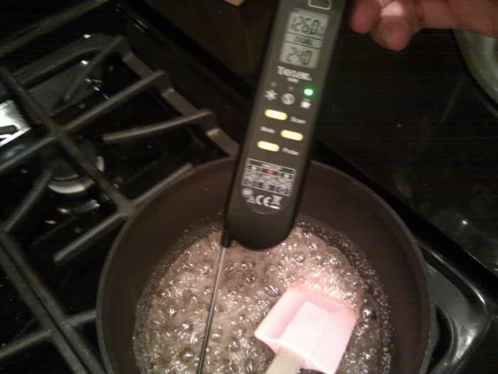 The "cooked sugar" (sucre cuit) will be bubbly and frothy, but will not caramelize due to the presence of the water.
