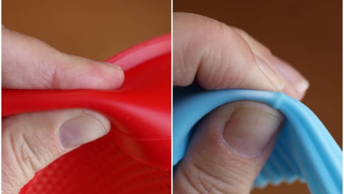 The cake pan on the left can't be pinched as much as the baking cup on the right because the one on the left is much stronger and made of 100% silicone. The cup on the right, however, has filler in it. That's why it turns white when bent.
