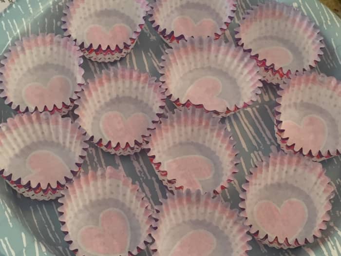Use paper mini-muffin cups in a container or plate for making candies.