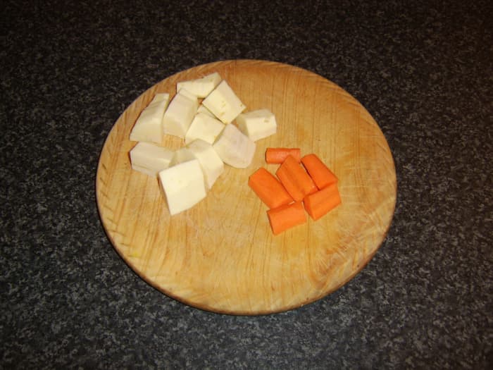 The chopped parsnip and carrot are the last ingredients to be added to the beef and root vegetable stew