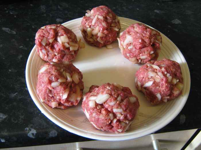 Knead the ground beef mixture into a ball with your hands to create the burgers.