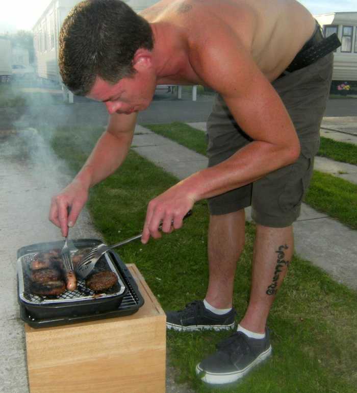 Cooking homemade hamburger patties on the BBQ