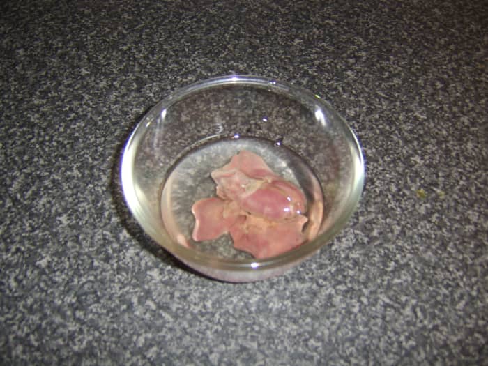Chicken livers are steeped in cold water for fifteen minutes prior to being cooked to remove the excess blood