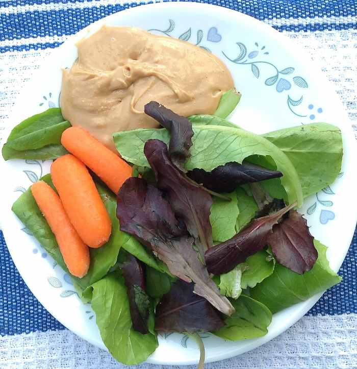 I include dark salad greens, carrots, and cashew butter in the smoothie.