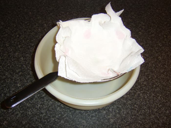 A lining of kitchen paper in the sieve will strain the finest impurities and much of the fat from the stock.