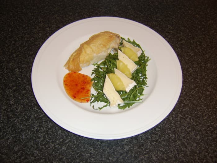 Leftover piece of roast chicken is served with a simple cheese and pineapple salad and sweet chilli sauce