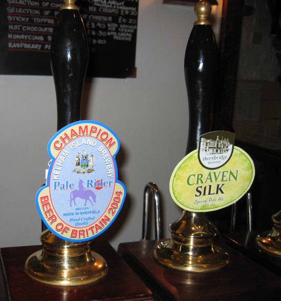 Beer pumps pulled by hand to fill the glass with beer from the pub cellar or cask.