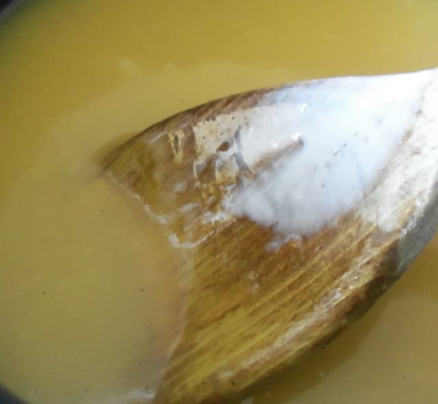 Remove from heat and stir in the vanilla, lemon juice and heavy cream to create a smooth texture.