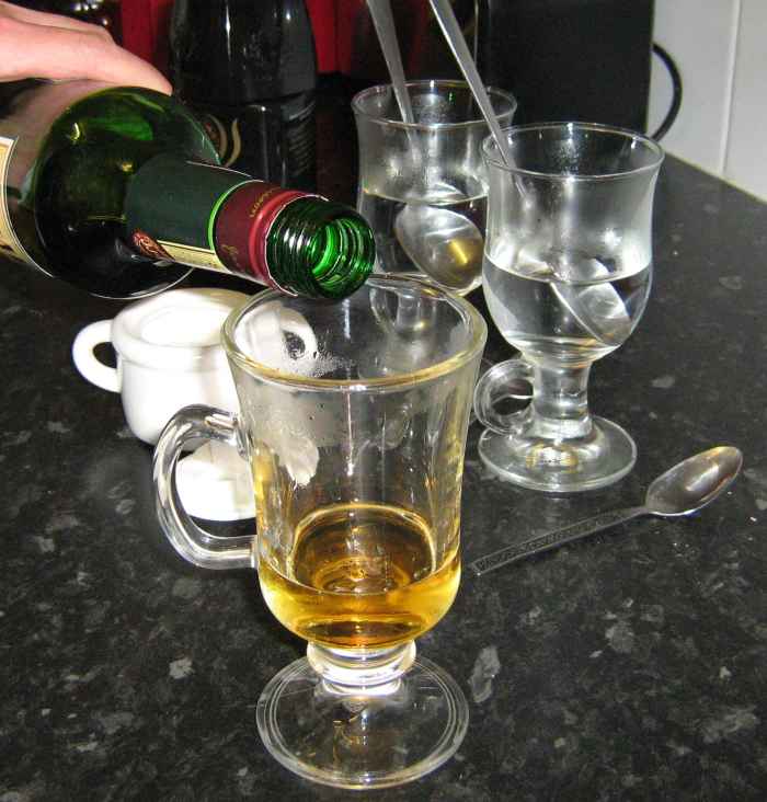 Add one measure of Jameson’s Irish whiskey to each glass.