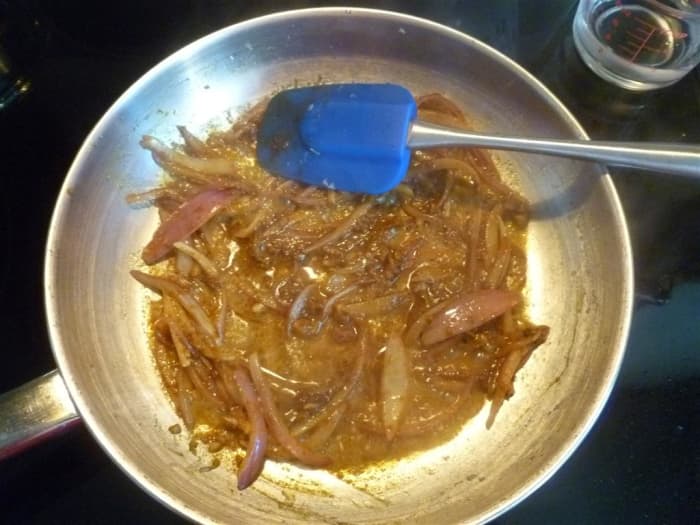 The tomatoes will start to break down as they cook, adding liquid to the pan. Cook for about 2 minutes.