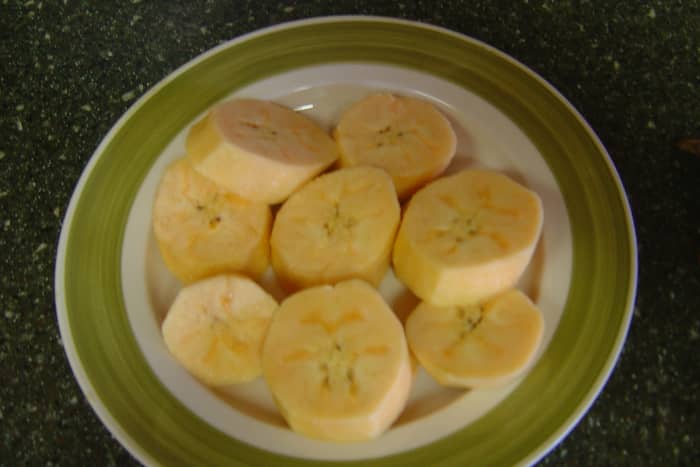 Remove the skin from cut plantains. Season with salt, pepper, and garlic (other seasonings optional).