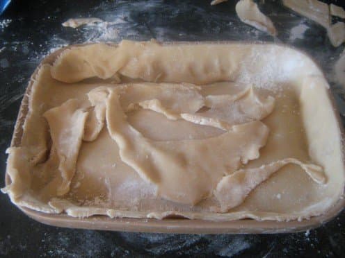 Cut the excess pastry off with a knife. I always add these bits to the top of the pastry because they cook crispy.