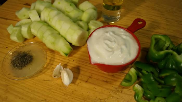 You'll need four cucumbers, plain yogurt, white wine vinegar, garlic, lime, dill and half of a green pepper to make cold cucumber soup.