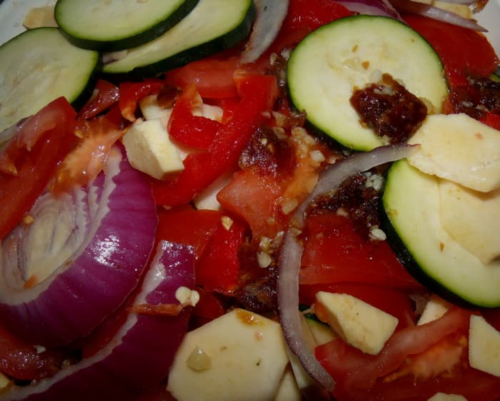 Chop up the veggies and dates and layer them in the slow cooker pot. Pour lemon, oil and spices over the veggies. Put on the lid.