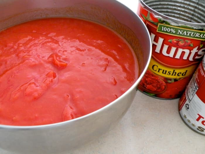 Mix tomato soup with crushed tomatoes and pour over the stuffed peppers and over the meat balls.