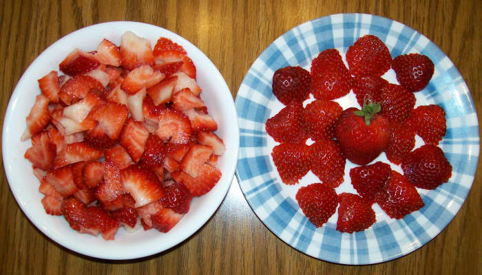 Cut most of the strawberries into small pieces. Keep one strawberry whole and thinly slice just a few to decorate the top of the dessert.