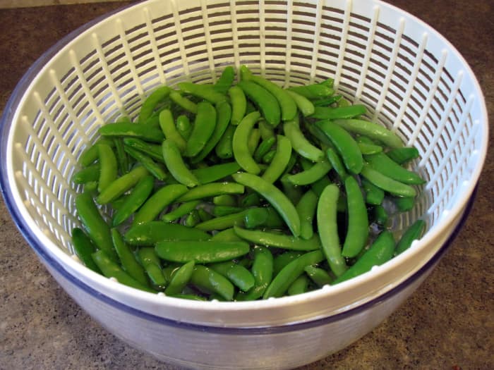 The bowl and colander insert of a salad spinner works well to cool vegetables after blanching.