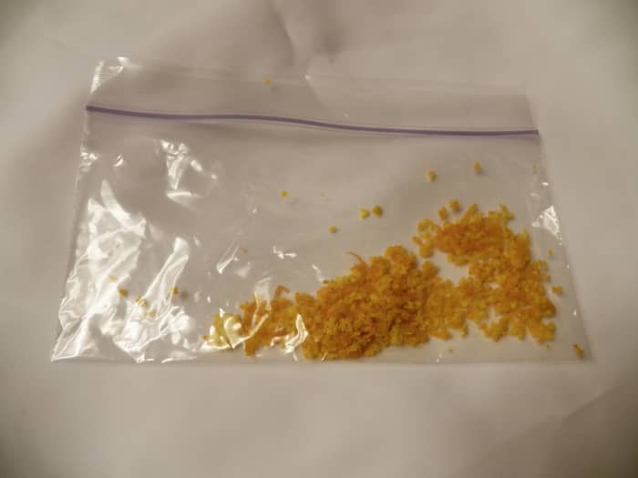 Store remaining leftovers in a Ziplock bag in the refrigerator for 3-4 days, or in the freezer for a month. Or dry your n the oven and store indefinitely. Or use it to make orange sugar.