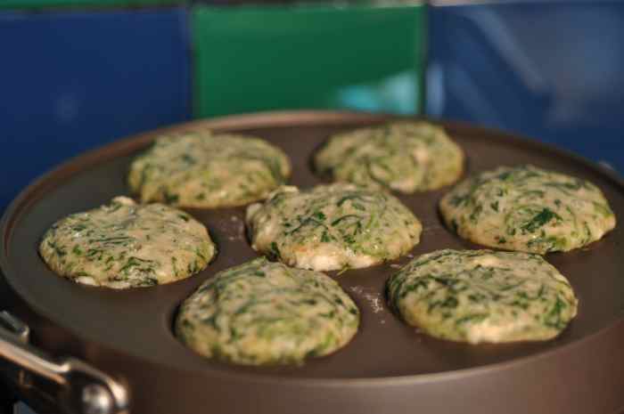Spinach and feta ebelskivers cooking in pan. Image: © Siu Ling Hui