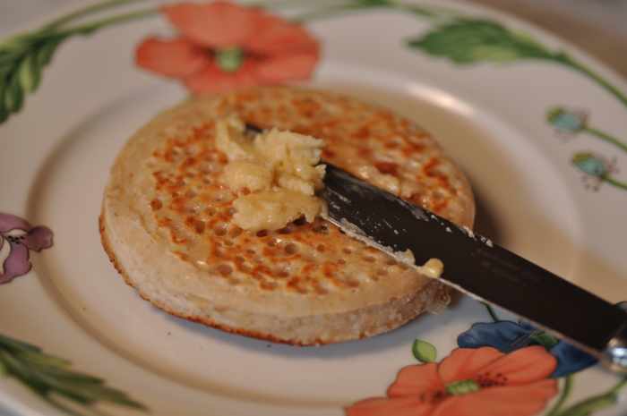 Lashings of honey butter on a hot sourdough starter crumpet. Image: © Siu Ling Hui