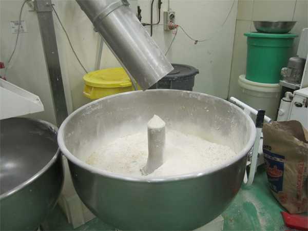 Flour is added to the leaven. 