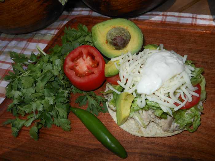 The options for creating your own chalupa are endless. Here is one with shredded boiled chicken, shredded lettuce, shredded mozzarella, sliced tomato, sliced avocado and Mexican crema. Delicioso!