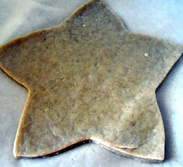 Roll out the dough and cut out the star shapes. Place on baking sheets lined with parchment and bake in the oven.