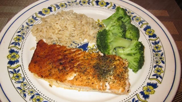 Serving suggestion: A healthy plate includes modest portions of salmon fillet, fresh steamed broccoli, and brown rice.