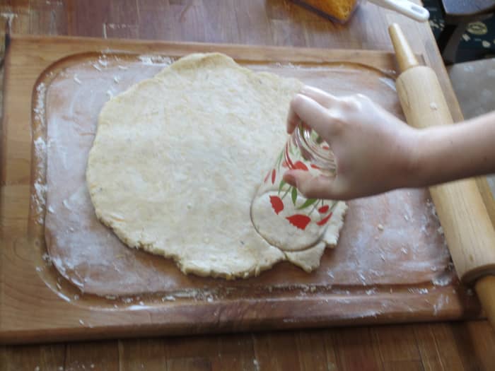 The drinking glass biscuit cutter trick: Press the mouth of the glass into the dough exactly as you would with a biscuit cutter.
