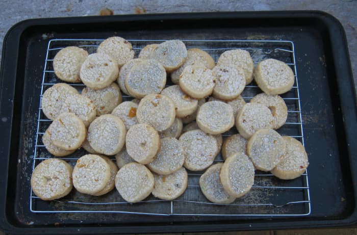 Chopped orange rind adds a new twist in standard shortbread cookies. A sprinkle of sugar on top adds twinkle.