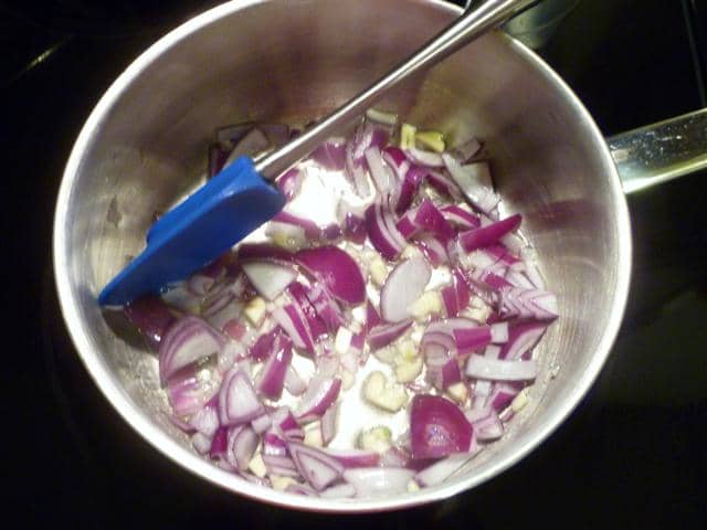 Melt 2 tablespoons of the butter and sweat the garlic and onion over medium-low heat until they soften a bit, about 3 or 4 minutes.