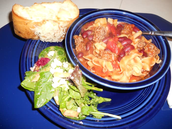 Paired with hot, crusty garlic cheese bread and fresh greens topped with feta cheese and honey-mustard chipotle dressing, this steaming bowl of Grandma's Northern Egg Noodle Chili is irresistible.