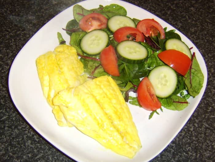 Haddock fillets are briefly marinated in turmeric, salt and lime juice before being pan-fried and served with a simple salad.