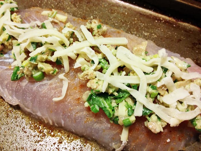 -- All Rights Reserved -- Do Not Distribute -- Spinach, Cream Cheese, Mozzarella Cheese, Scallions, Milk Wet Mixture Spread on Basa Fish Fillet, Sprinkled with Mozzarella Cheese