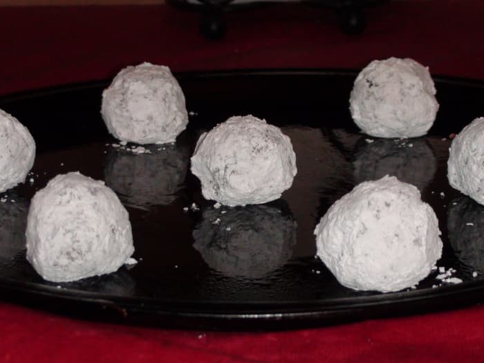 7. Make sure to get plenty of powdered sugar on the golf-ball-sized balls. Leave them plenty of room on the cookie sheet to spread.