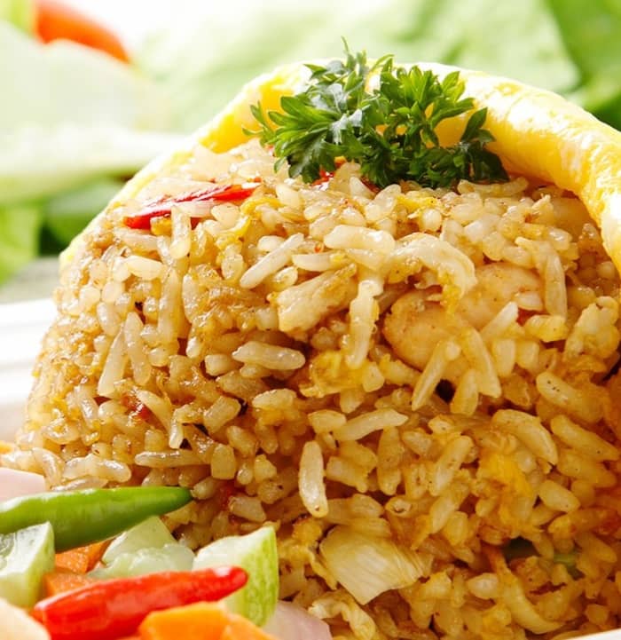 Brown rice is less liable to get soggy in a salad, and it also brings its own nutty flavor to the dish.