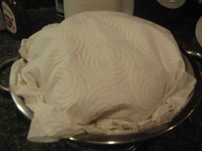 I cover my homemade biscuits with a cloth or thick paper towels to keep them warm.