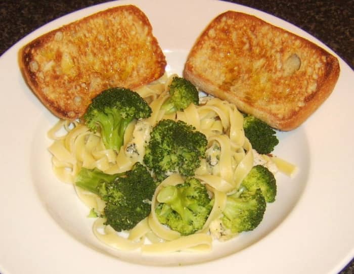 Stilton cheese and broccoli are stirred through tagliatelle pasta before it is served with simple bruschetta