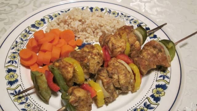 These low-fat, lower sodium kabobs are served with brown rice and freshly cut, boiled carrots for a healthy meal.