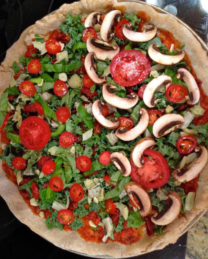 Add desired toppings, the more veggies, the better. It's your pizza so customize each side depending on preferences. Go easy on the cheese. Bake with toppings 8–10 minutes.