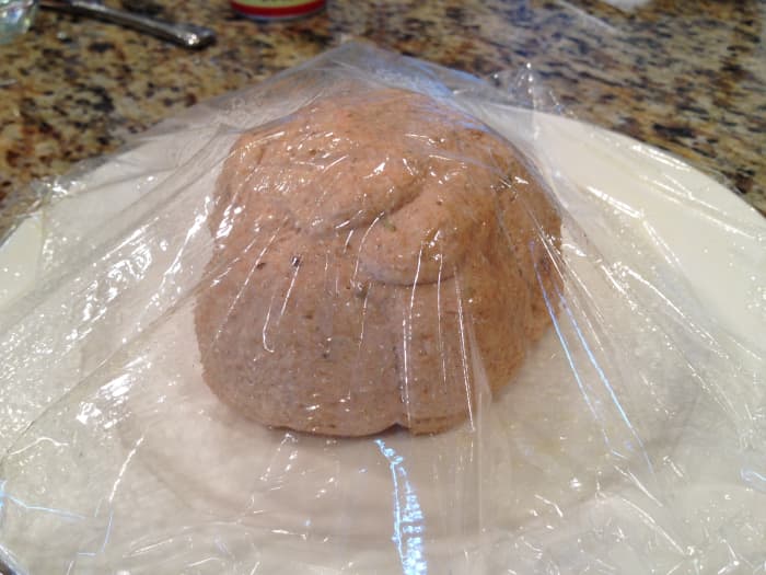 Spray a plate and one side of a sheet of plastic wrap with cooking spray. Place the dough on the plate and cover, sprayed side down, with plastic wrap. Let dough rest for 15 to 20 minutes.