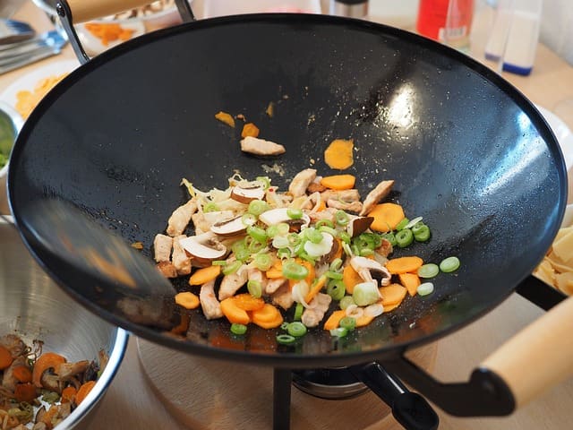 Woks are great for whipping together quick vegetable dishes. Within ten minutes you can have a meal prepared that is super healthy. You can get away with a small amount of oil, provided you heat it to a high enough temperature.