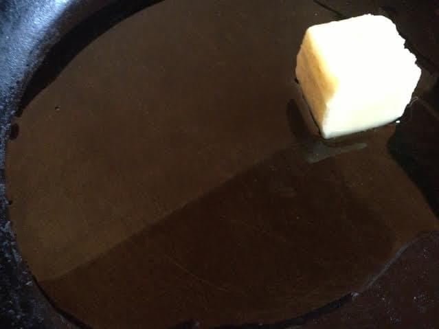 Put an oven-proof skillet on the stove on medium heat and add the olive oil and butter.