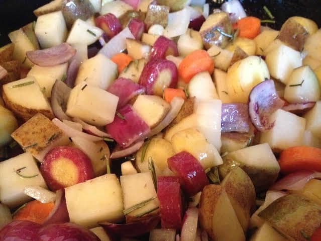 Add the carrots and potatoes and stir them to coat them in the oil and butter. Let them cook on top of the stove for a few minutes.