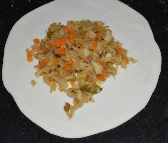 Step two: Make small round discs as per instructions. Place 1 teaspoon of stuffing in the center of each wrapper.