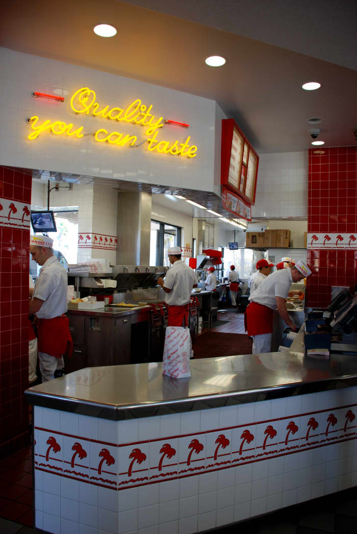 The busy INO "stand" (kitchen). Typically, there are about 12–14 people working per shift, not including managers. Busier/quieter shifts require more/less associates.