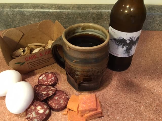 Some of the raw ingredients for the "Full American Fry-Up:" mushrooms, Spam, black pudding, and eggs, plus a home brewed braggot (mead with Scotch ale grains).