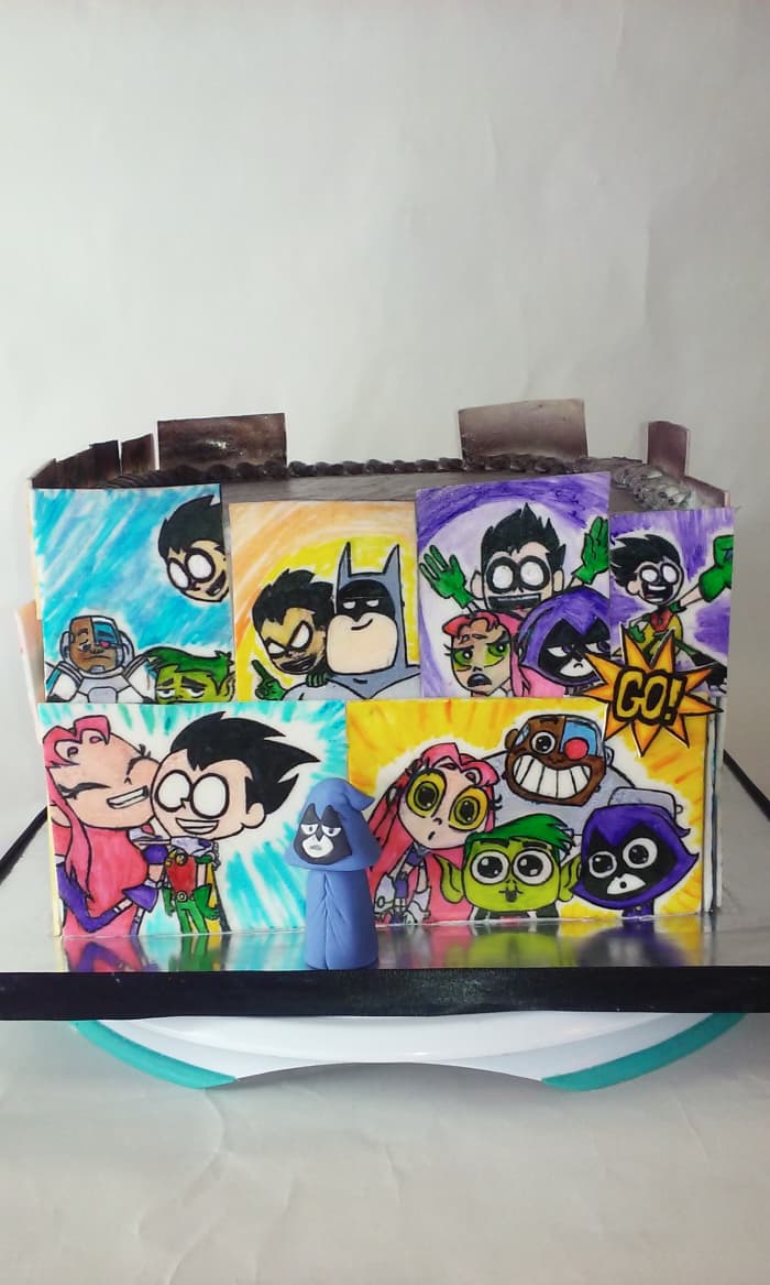 This entire hand-painted gumpaste facade of this cake is made of gumpaste tiles. I needed a medium that would dry rock hard so I could hand paint the comics on it.