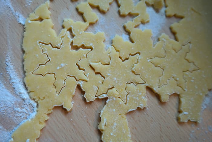 roll dough out on a lightly floured surface, cut, and carefully move to prepared baking sheet